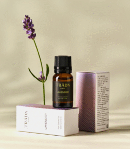 Lavender Essential Oil 10ml by TRÄDN displayed with box and lavender stem – French origin